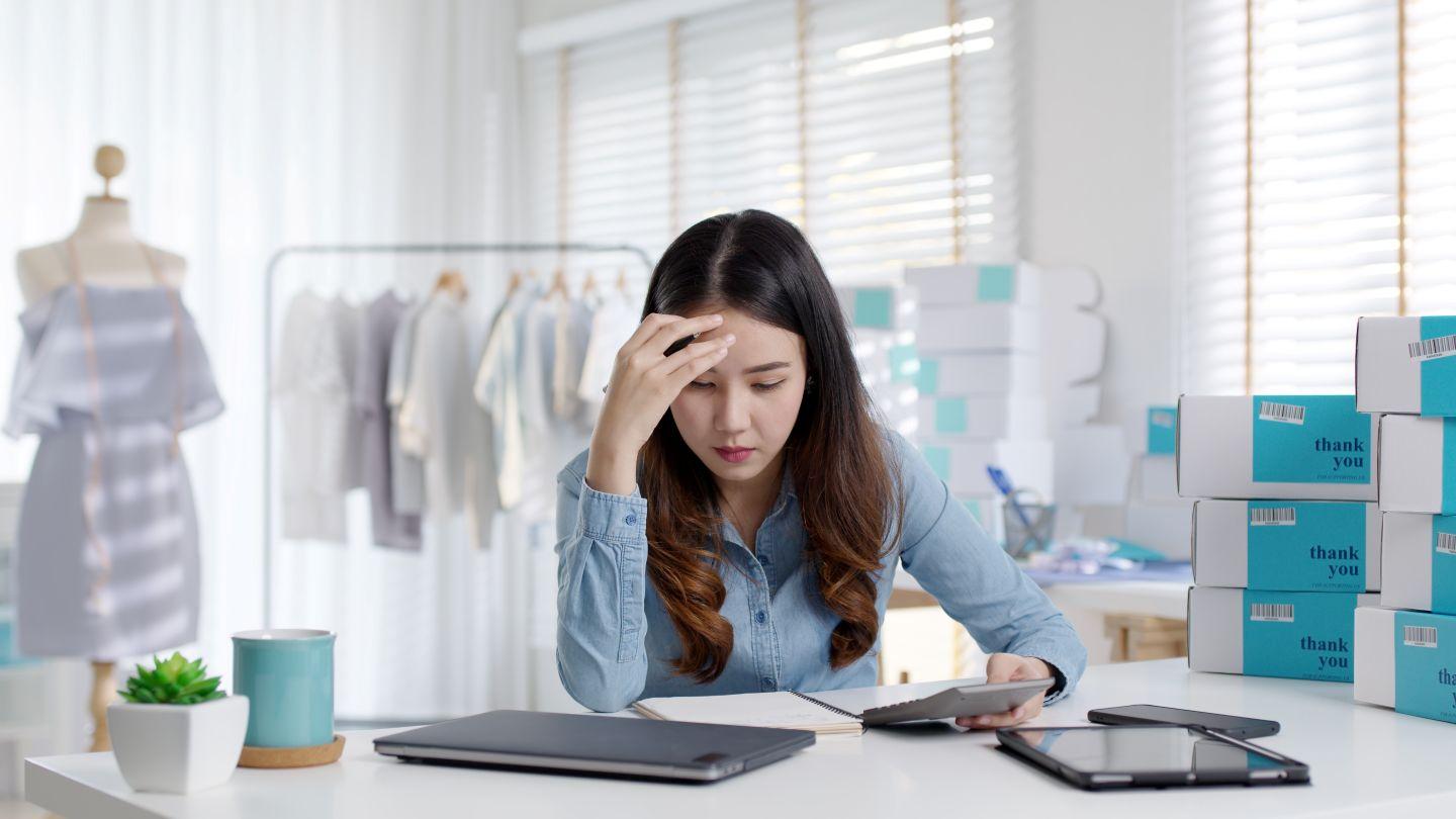 Woman working on laptop.